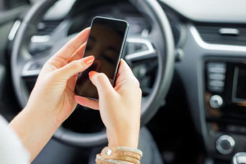 Woman texting and driving