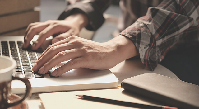 hands typing on a keyboard_internship program_pest control